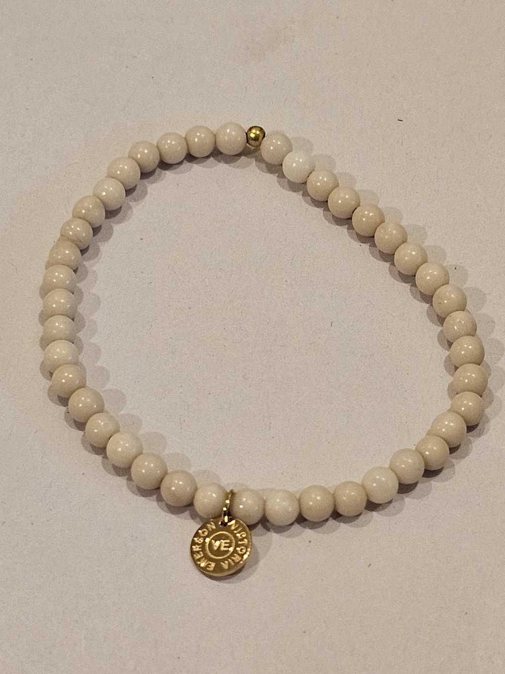 Victoria Emerson Cream Beaded Bracelet with Gold Charm